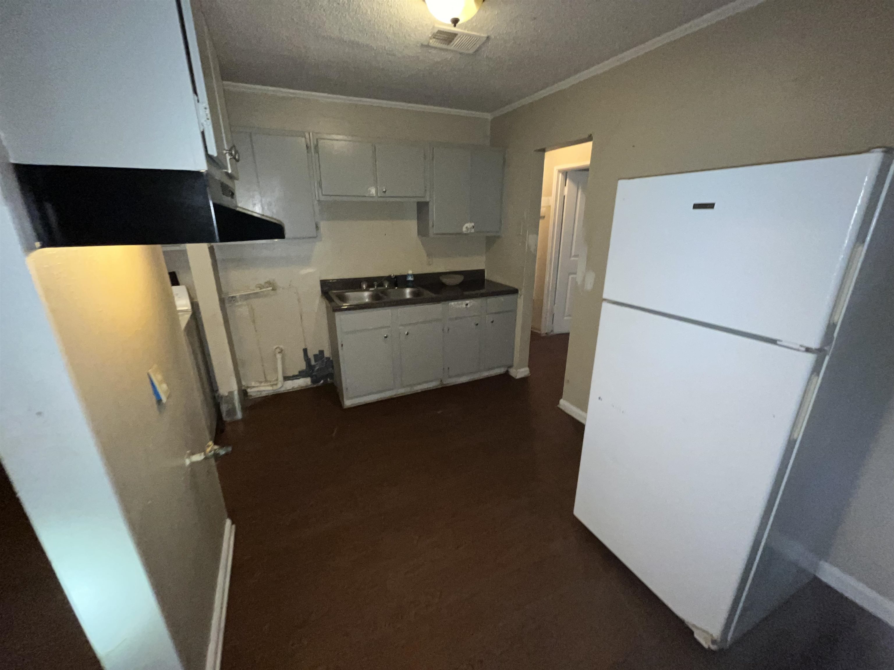 691 Delta Road Memphis, TN 38109 - Photo 6 of 25 a refrigerator freezer sitting inside of a kitchen