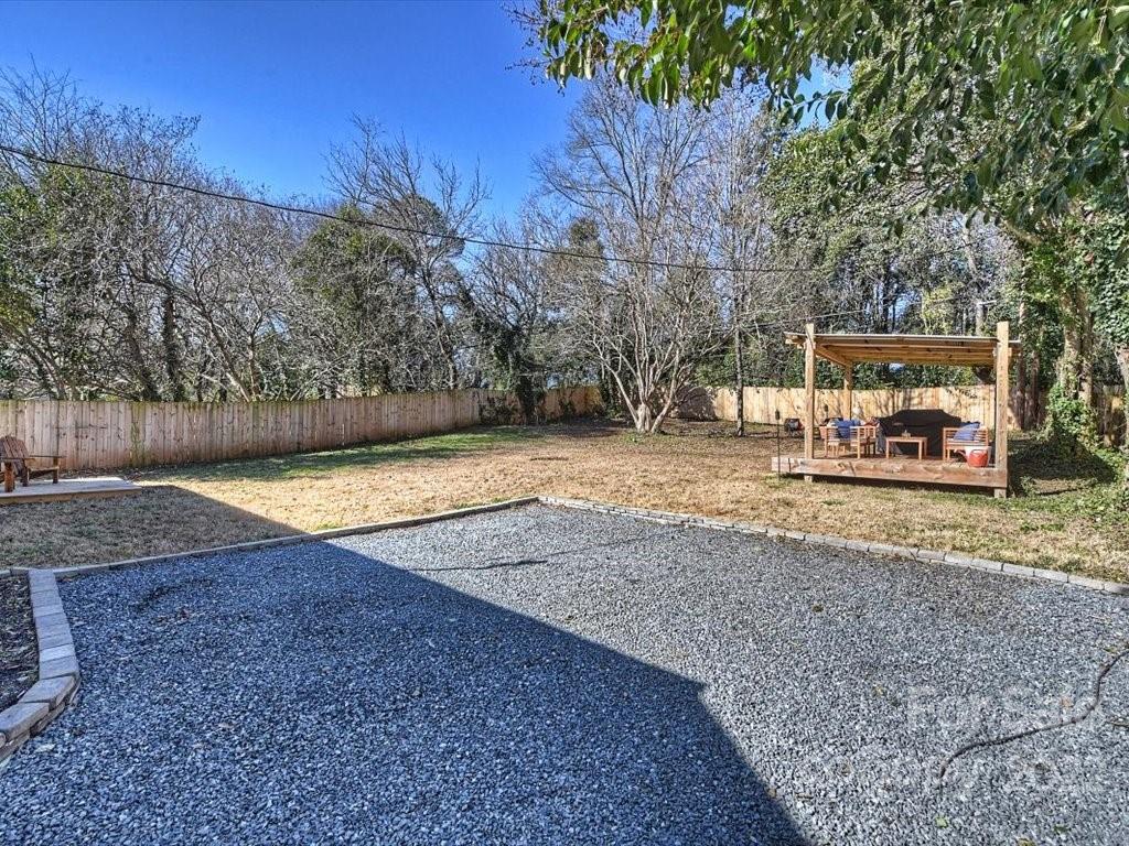 2734 Cowles Road Charlotte, NC 28208 - Photo 21 of 26 a view of a swimming pool with an outdoor space