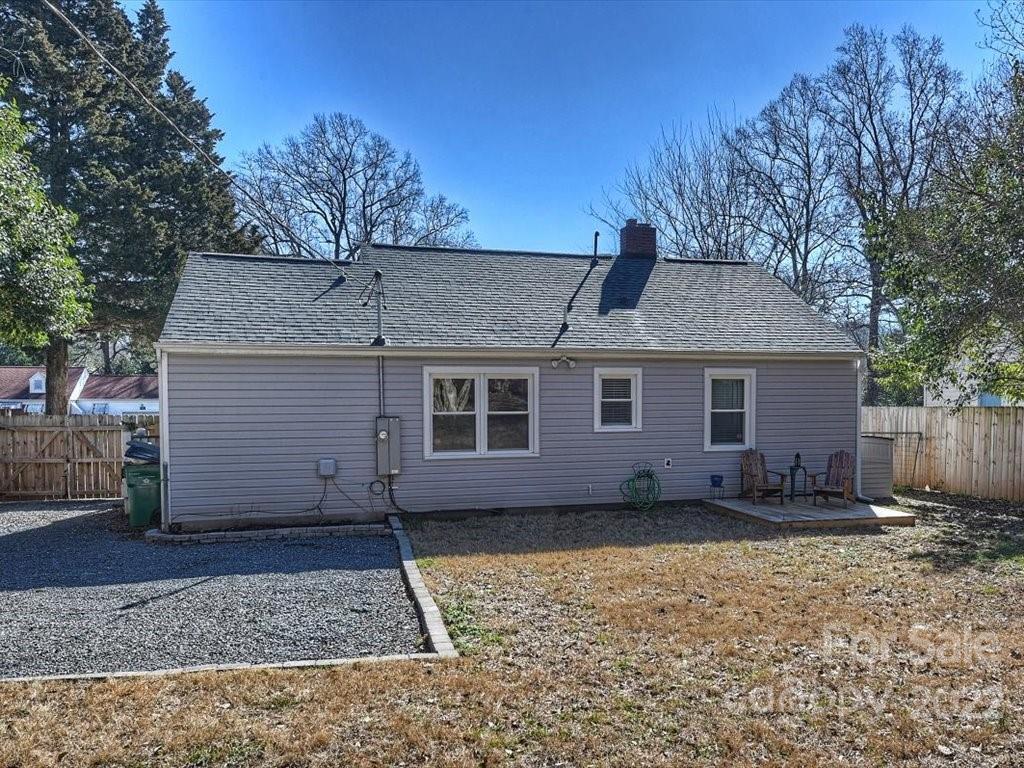 2734 Cowles Road Charlotte, NC 28208 - Photo 24 of 26 a front view of a house with a yard