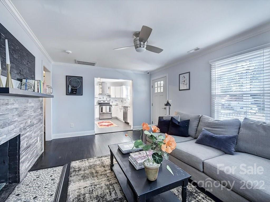 2734 Cowles Road Charlotte, NC 28208 - Photo 5 of 26 a living room with furniture and a fireplace