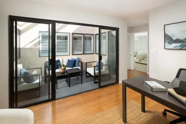 a living room with furniture and a window