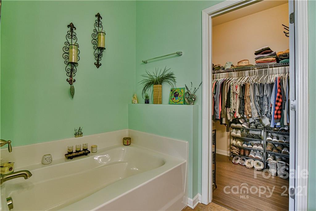 74 North River Road Fletcher, NC 28732 - Photo 15 of 29 a bathroom with a bathtub and a window
