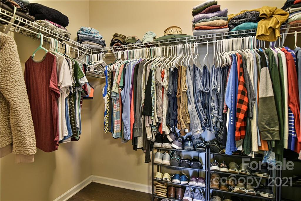 74 North River Road Fletcher, NC 28732 - Photo 18 of 29 a view of walk in closet with clothes and shoes
