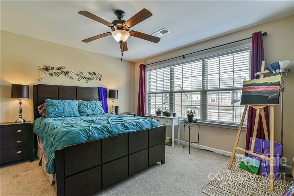 74 North River Road Fletcher, NC 28732 - Photo 20 of 29 a bedroom with a bed dresser and a window