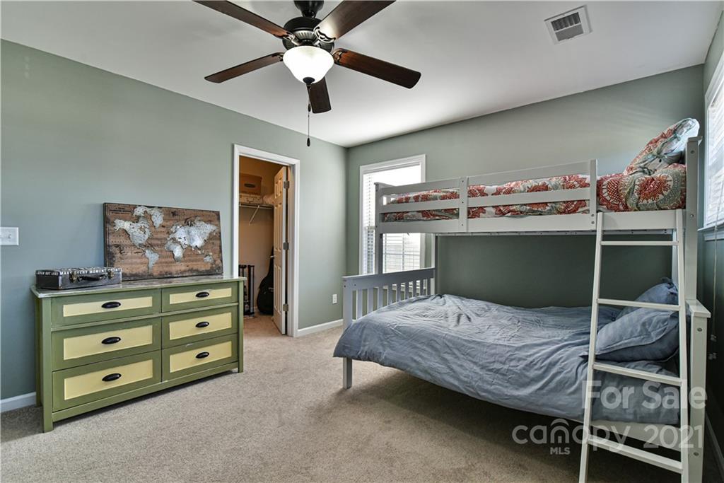 74 North River Road Fletcher, NC 28732 - Photo 21 of 29 a bedroom with a bed and furniture