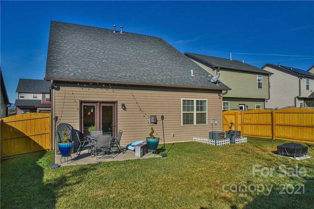 74 North River Road Fletcher, NC 28732 - Photo 27 of 29 a backyard of a house with barbeque oven table and chairs