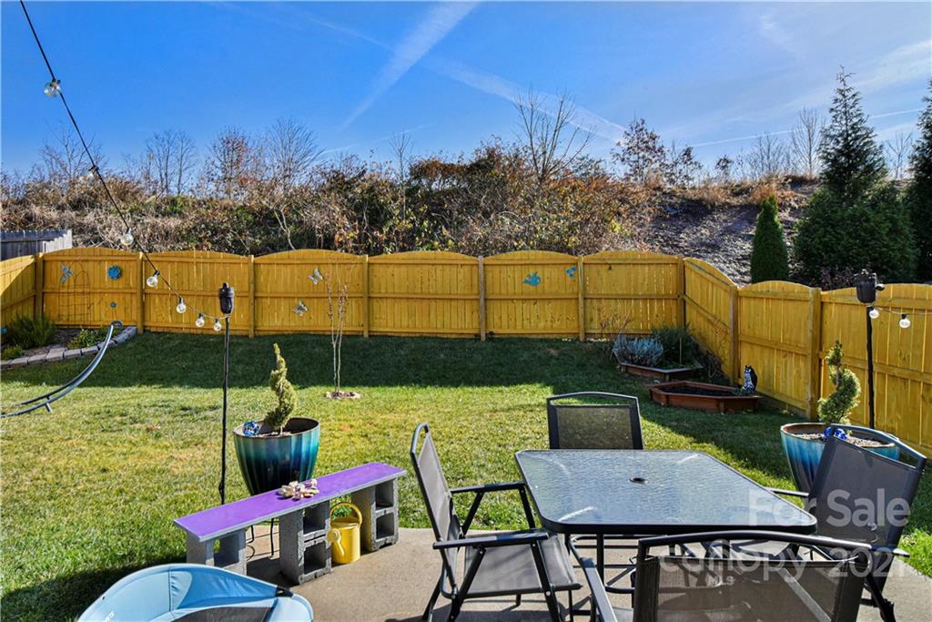 74 North River Road Fletcher, NC 28732 - Photo 28 of 29 a view of a chairs and table in patio