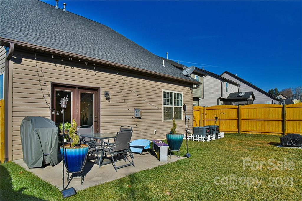 74 North River Road Fletcher, NC 28732 - Photo 29 of 29 a view of a patio with chairs and potted plants