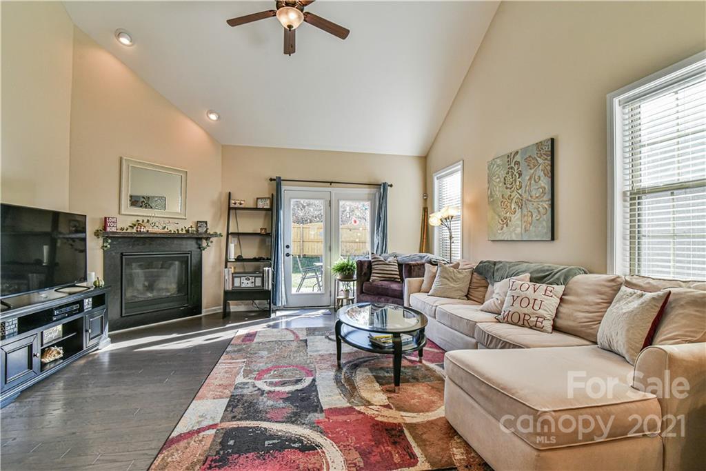 74 North River Road Fletcher, NC 28732 - Photo 4 of 29 a living room with furniture a flat screen tv and a fireplace