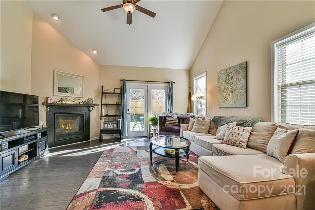 74 North River Road Fletcher, NC 28732 - Photo 5 of 29 a living room with furniture a flat screen tv and a fireplace