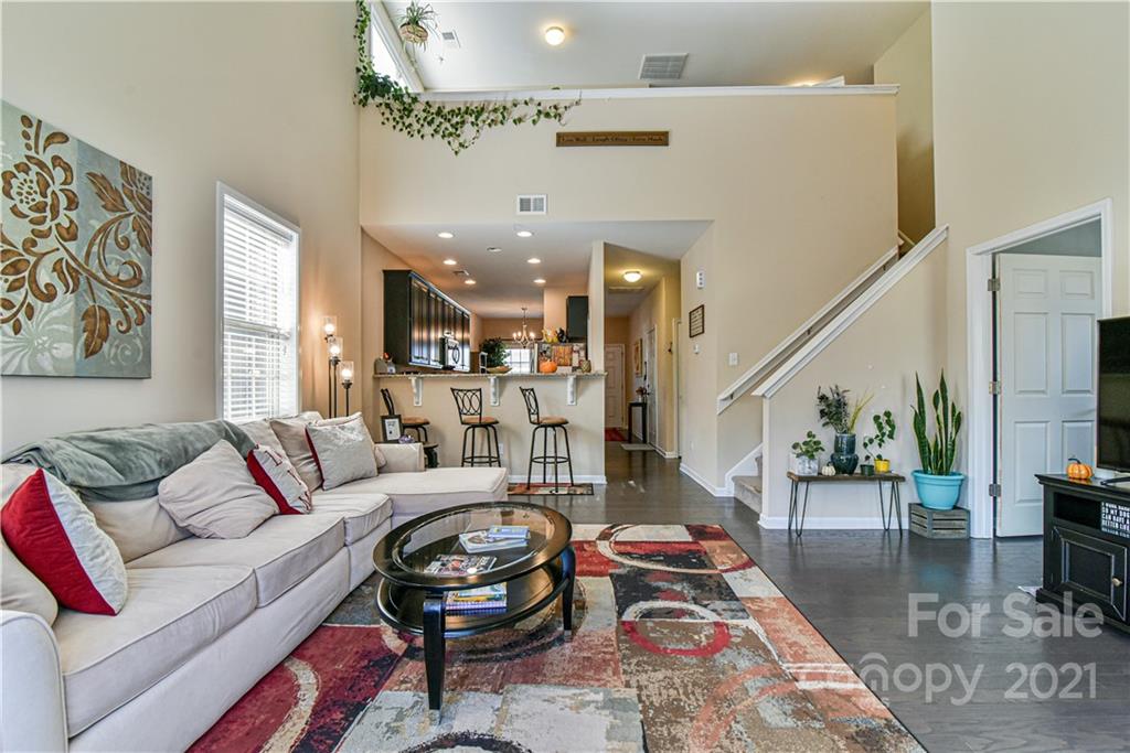 74 North River Road Fletcher, NC 28732 - Photo 6 of 29 a living room with furniture and a chandelier