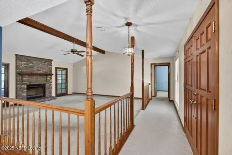 a view of a hallway with a chandelier