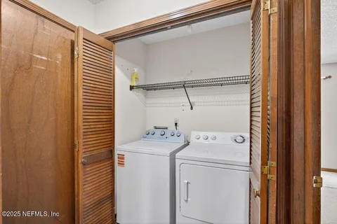 a utility room with dryer and washer