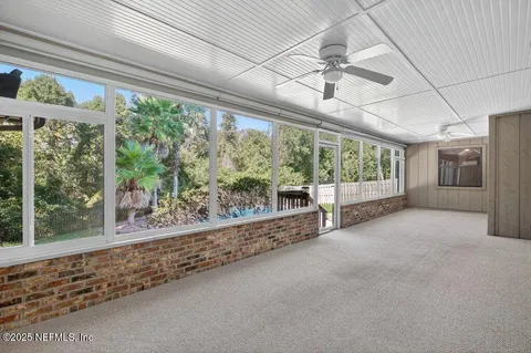 a view of a room with porch and wooden roof