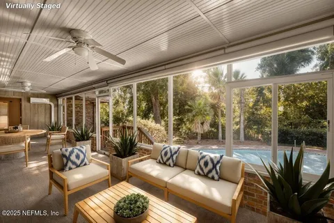 an empty room with a ceiling fan and window
