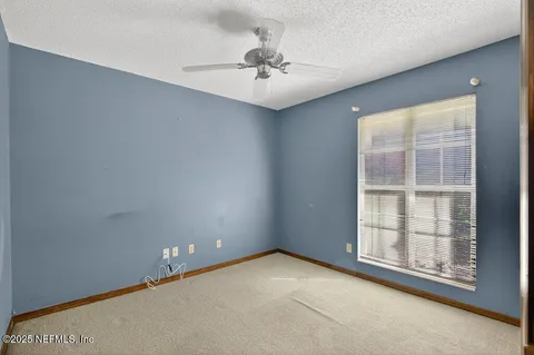 a view of a livingroom with a staircase