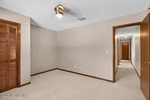 a view of a backyard with swimming pool