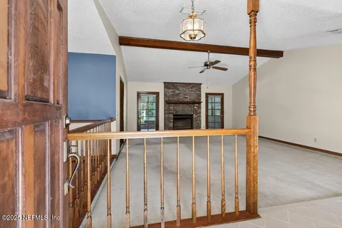 a view of a porch with a table and chairs