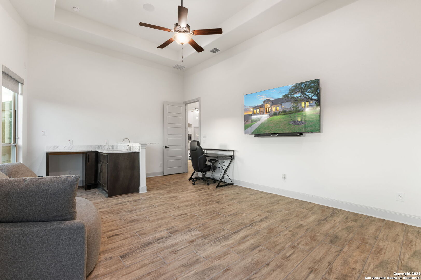 3865 Fox Trot Trail Bulverde, TX 78163 - Photo 15 of 32 a living room with furniture and a flat screen tv