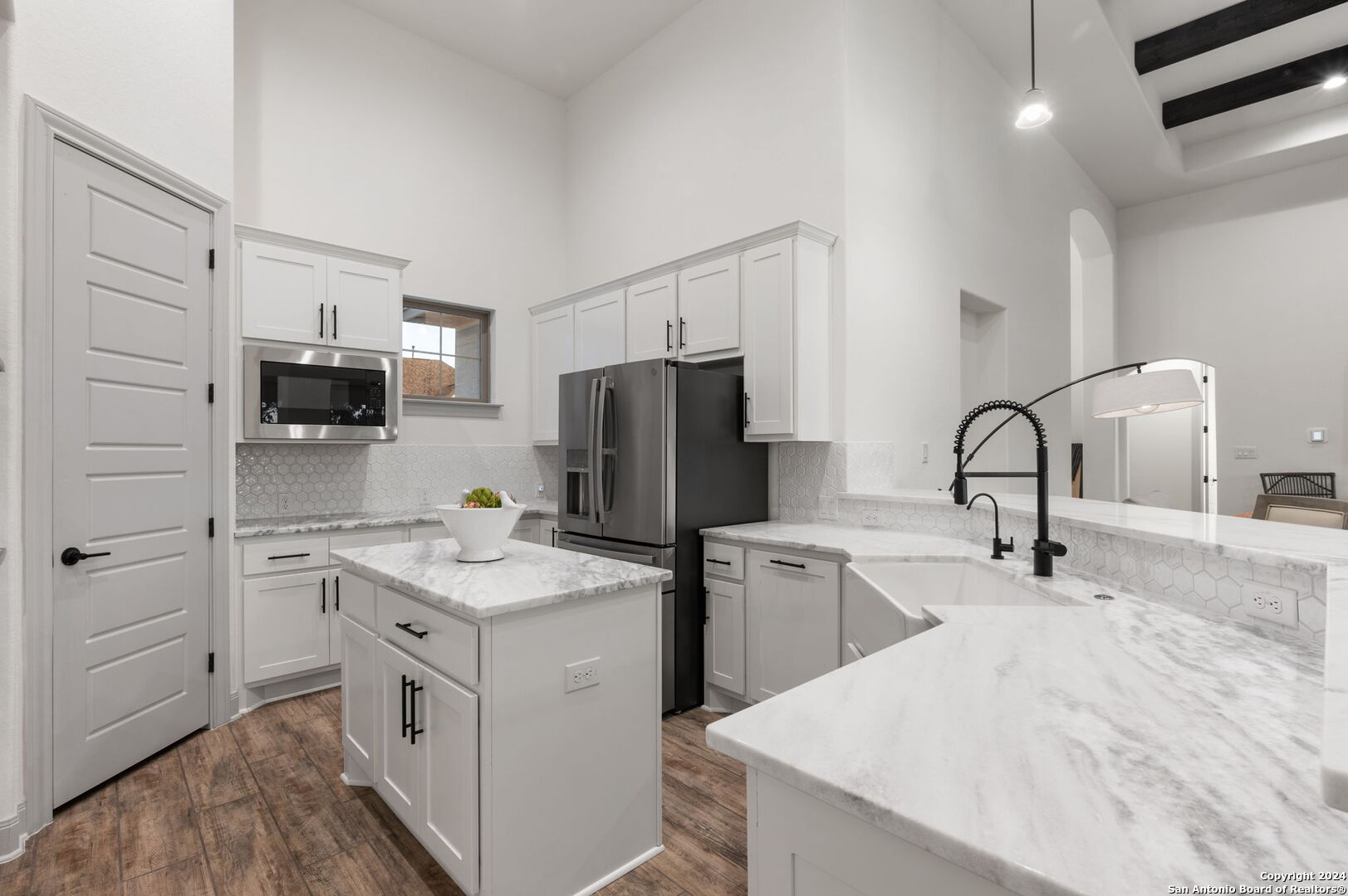3865 Fox Trot Trail Bulverde, TX 78163 - Photo 10 of 32 a kitchen with a sink stainless steel appliances and cabinets
