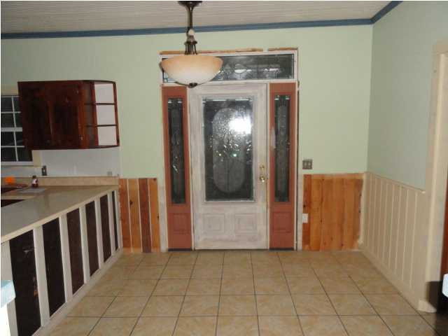 1121 Lighthouse Church Road Baker, FL 32531 - Photo 16 of 16 a view of a hallway with entryway and dining room