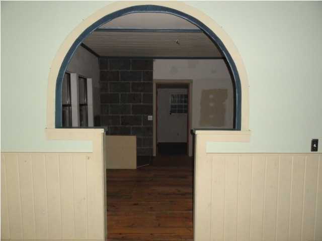 1121 Lighthouse Church Road Baker, FL 32531 - Photo 3 of 16 a view of a hallway with wooden floor and entryway