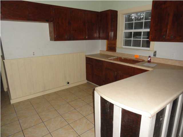 1121 Lighthouse Church Road Baker, FL 32531 - Photo 4 of 16 a kitchen with a cabinets and window