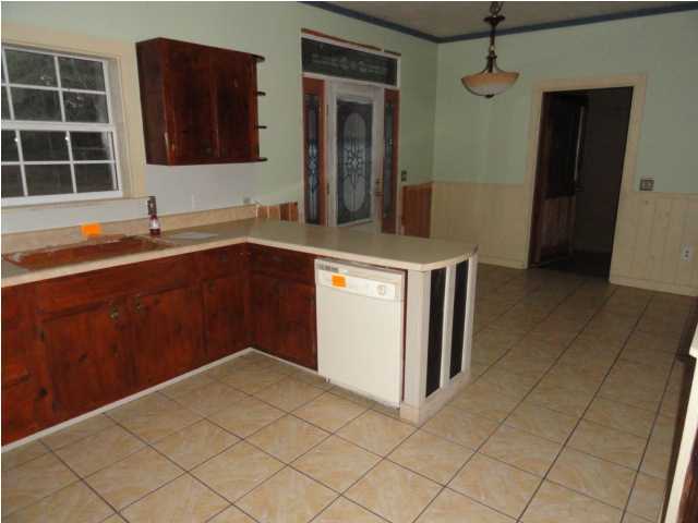 1121 Lighthouse Church Road Baker, FL 32531 - Photo 5 of 16 a kitchen with stainless steel appliances a sink and cabinets