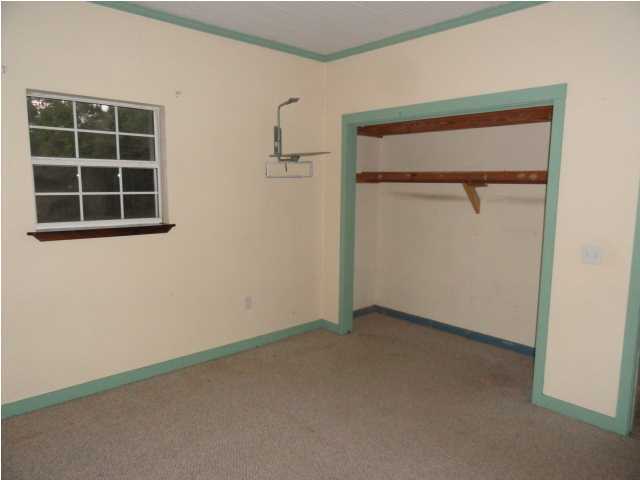 1121 Lighthouse Church Road Baker, FL 32531 - Photo 9 of 16 an empty room with a window