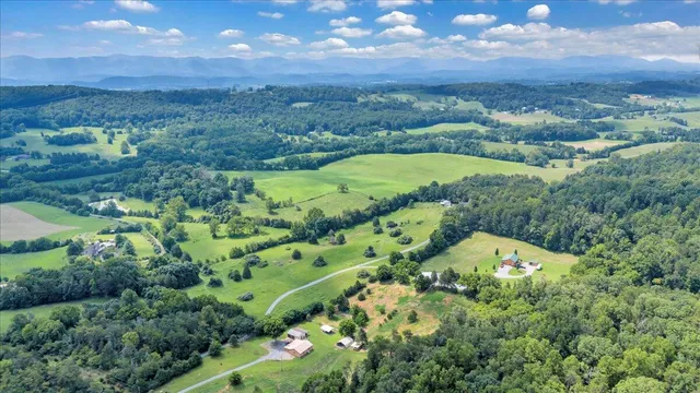 a kitchen with stainless steel appliances granite countertop a refrigerator and a stove