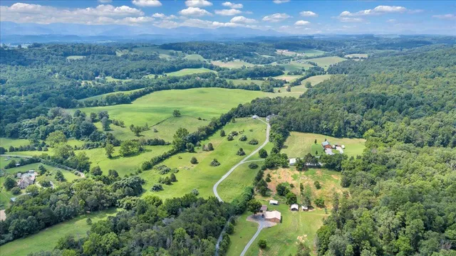a living room with furniture fireplace and a window