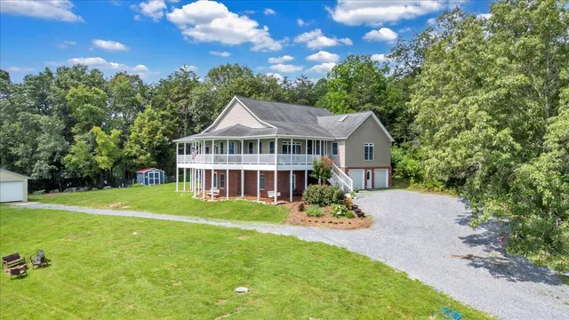 a view of a house with a yard porch and sitting area