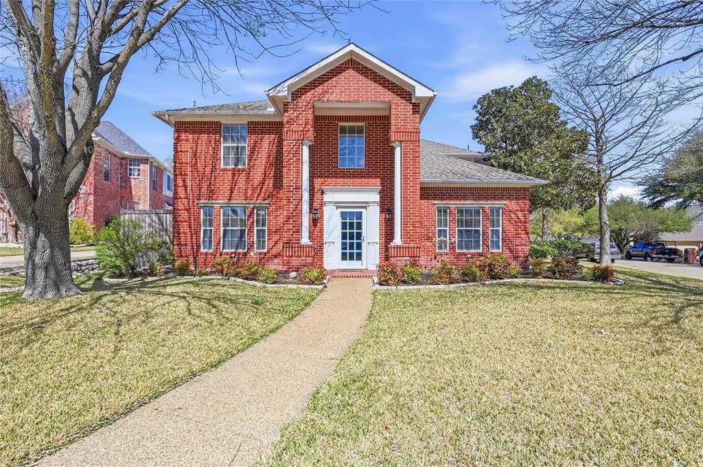 front view of a house with a yard