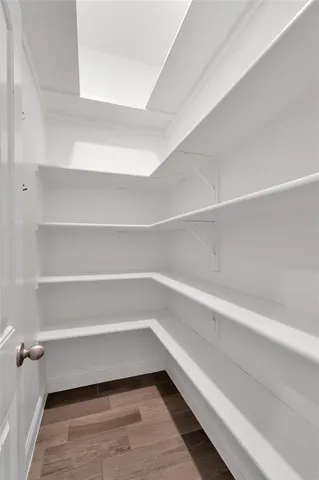 a storage room with a wooden floor