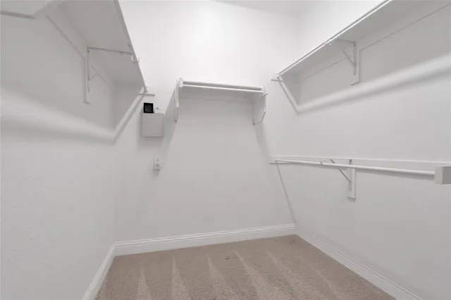 a view of an empty walk in closet