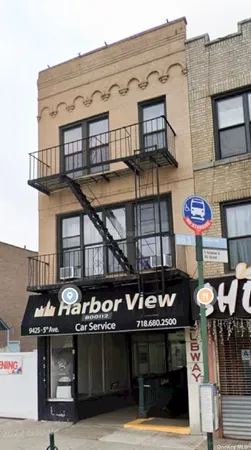 a front view of a building with retail shops