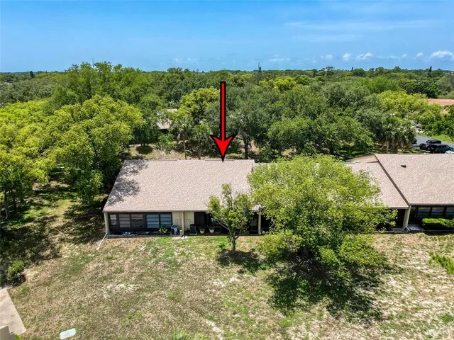 a aerial view of a house with a yard
