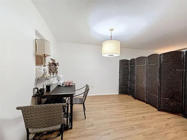 a workspace with furniture and wooden floor