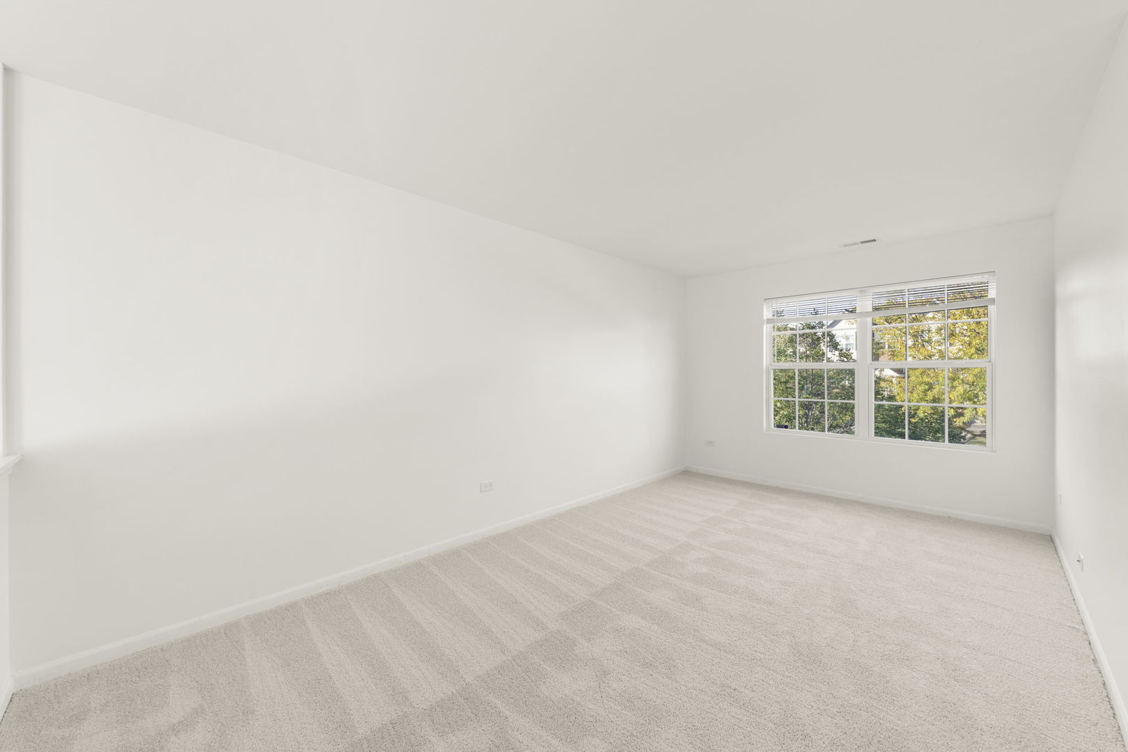 274 South Oak Creek Lane Romeoville, IL 60446 - Photo 14 of 19 an empty room with windows