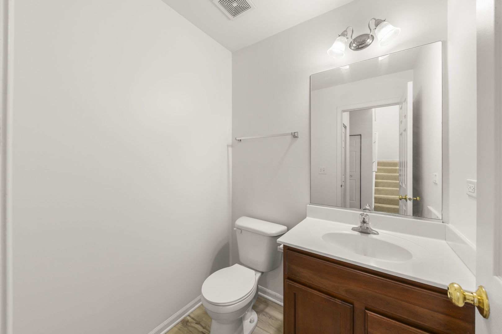 274 South Oak Creek Lane Romeoville, IL 60446 - Photo 9 of 19 a bathroom with a sink a toilet and mirror