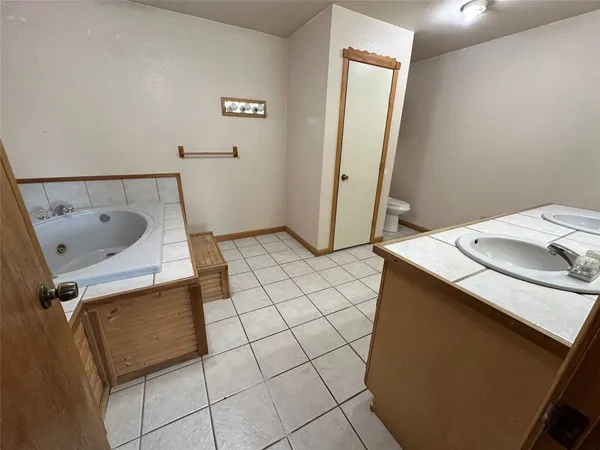 a view of a backyard with swimming pool