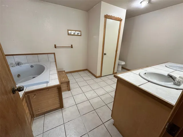 a view of a backyard with swimming pool