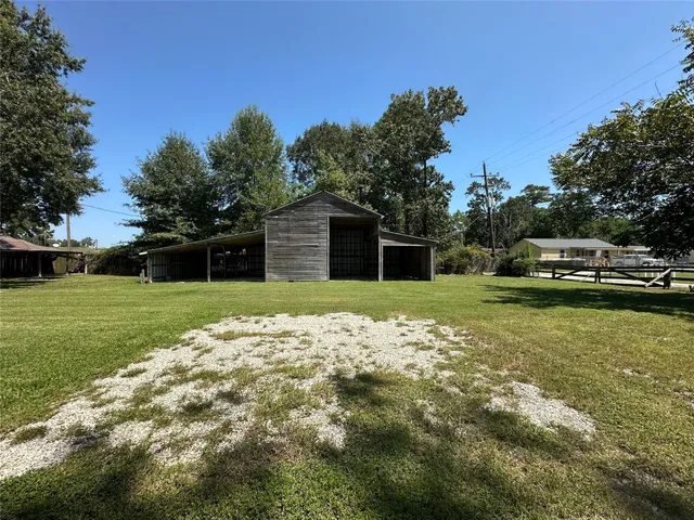 a view of a backyard with a small cabin