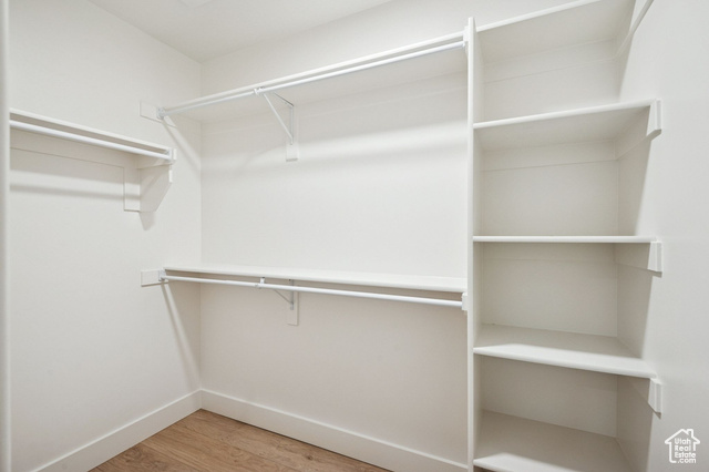 1615 North Angel Street, Unit E Layton, UT 84041 - Photo 25 of 42 Walk in closet featuring light wood-style floors