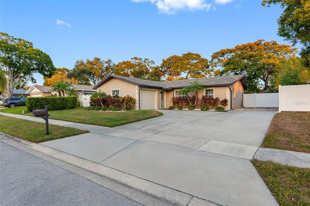 8139 129th Lane Seminole, FL 33776 - Photo 1 of 48 a view of house with outdoor space and street view