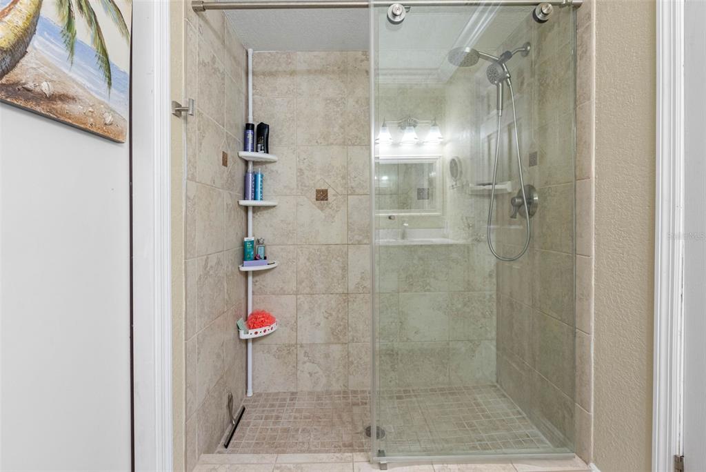 8139 129th Lane Seminole, FL 33776 - Photo 17 of 48 a bathroom with a shower and a sink