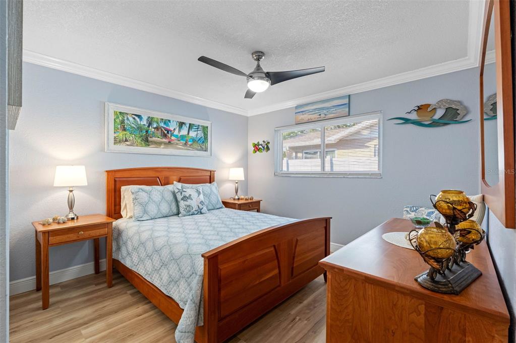 8139 129th Lane Seminole, FL 33776 - Photo 18 of 48 a bedroom with a bed and wooden floor