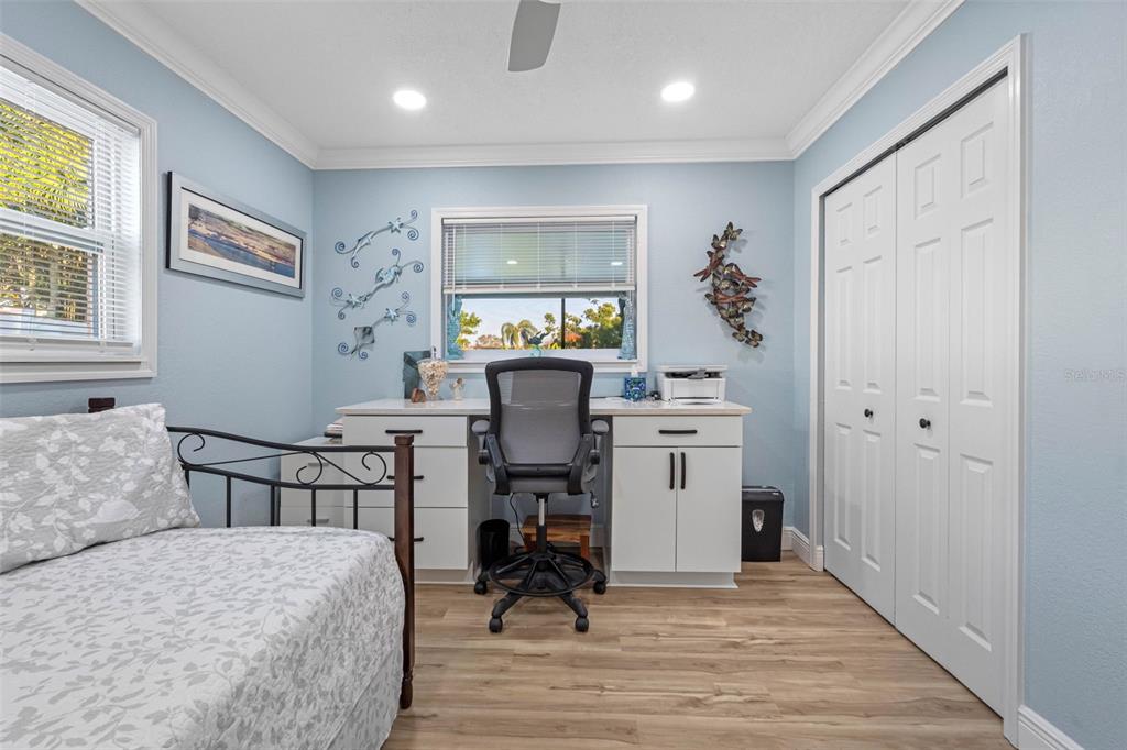 8139 129th Lane Seminole, FL 33776 - Photo 22 of 48 a view of a workspace with furniture and a window