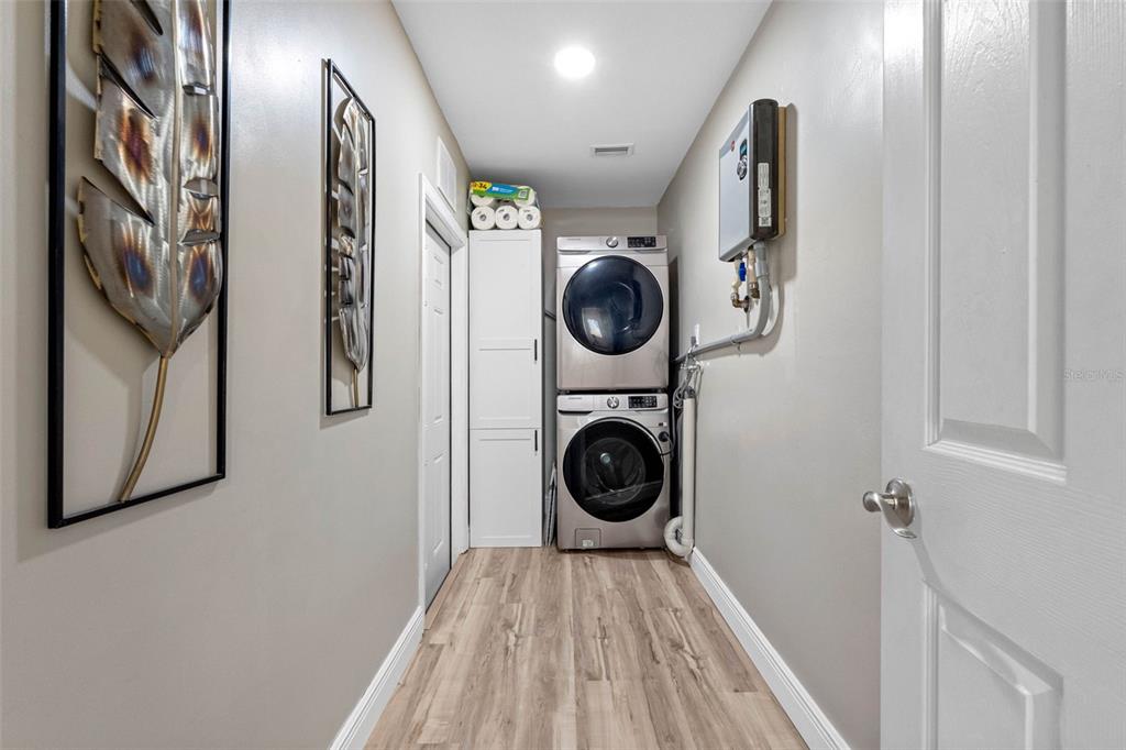 8139 129th Lane Seminole, FL 33776 - Photo 23 of 48 a view of a hallway with washer and dryer
