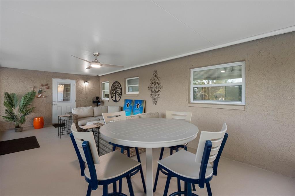 8139 129th Lane Seminole, FL 33776 - Photo 26 of 48 a view of a dining room with furniture and window